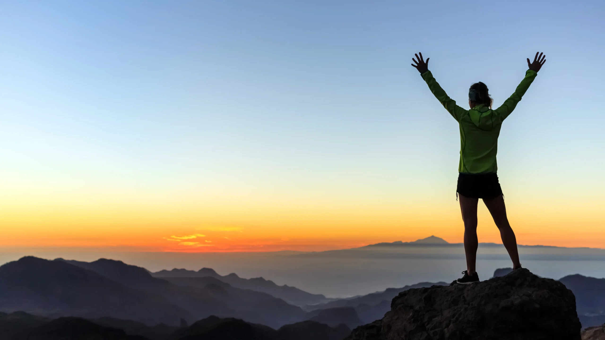 woman climber on top of a mountain