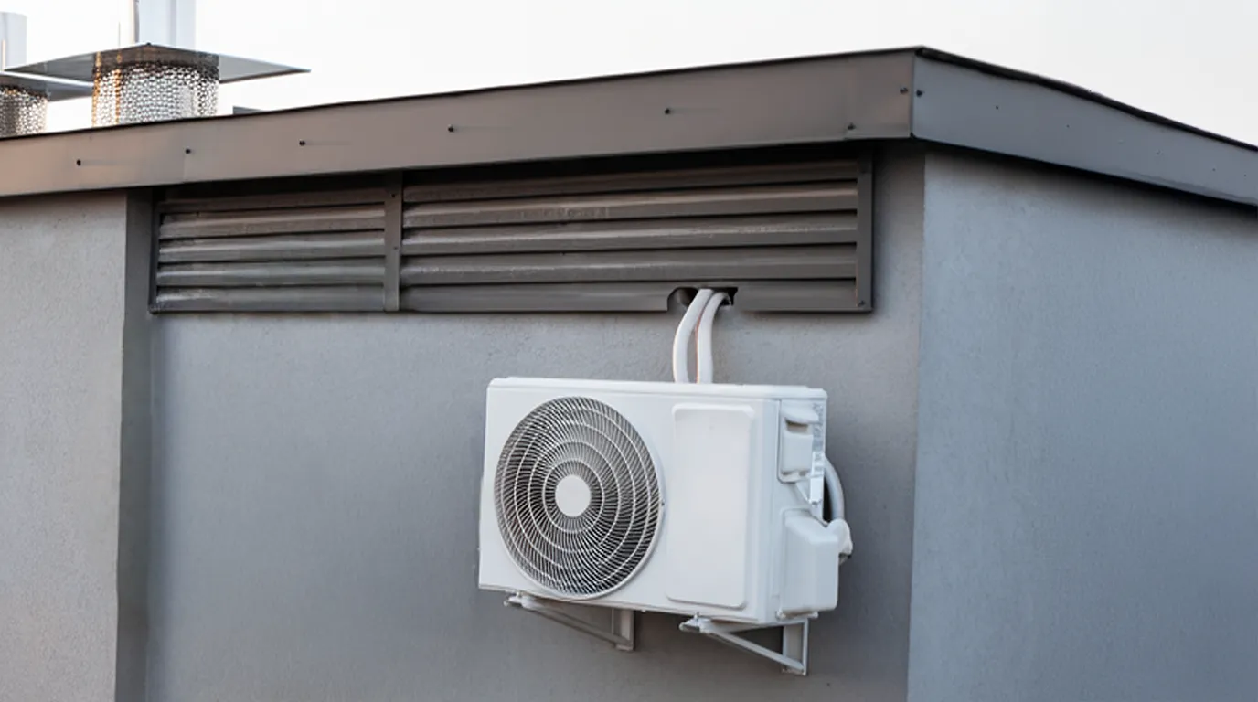 single fan on the side of a building